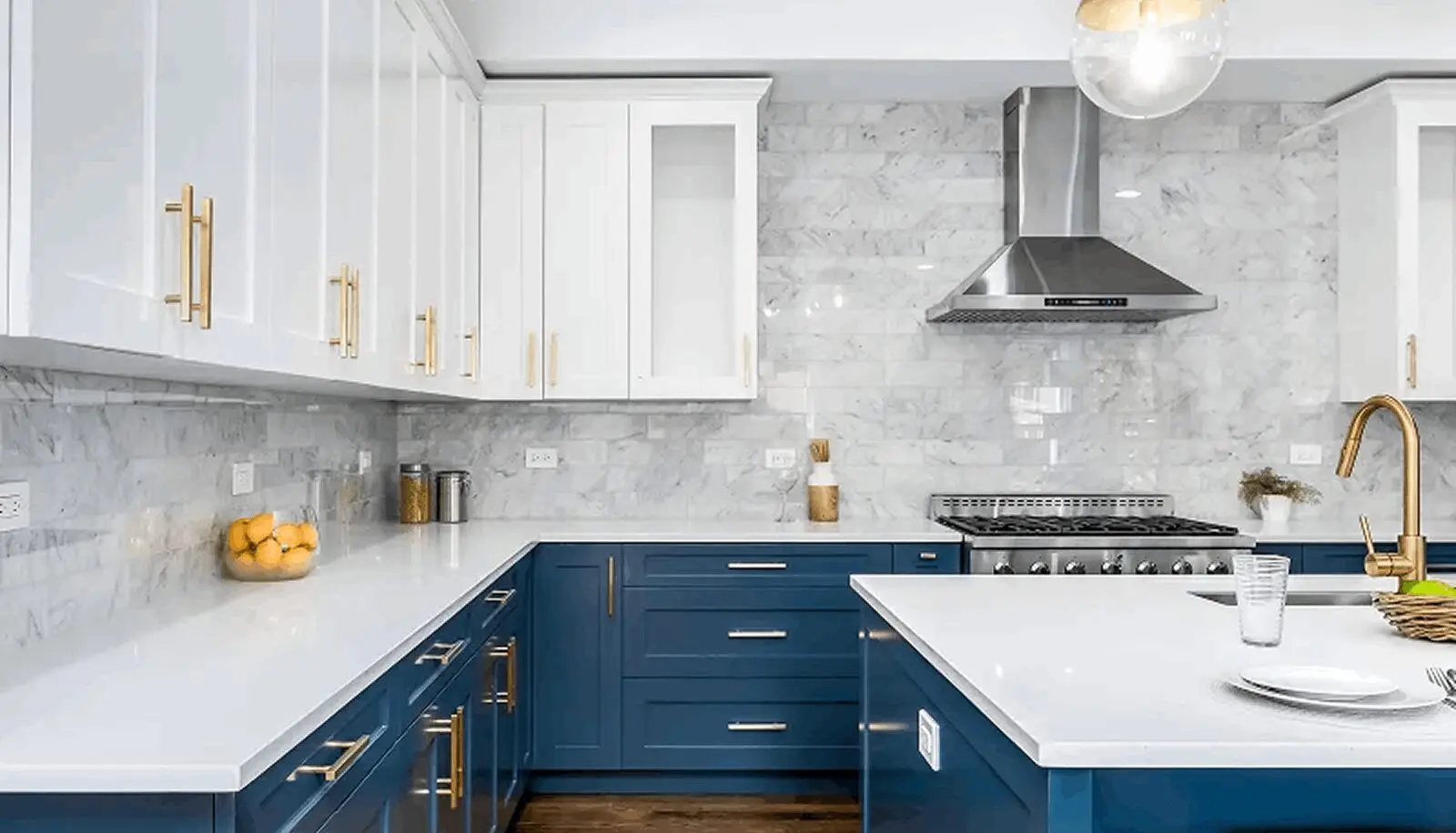 Modern kitchen with navy blue lower cabinets and white upper cabinets.
