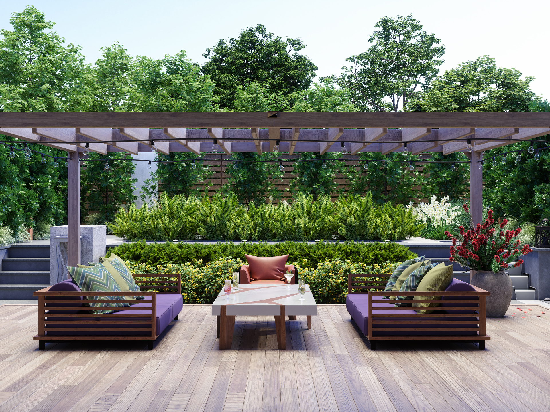 Modern outdoor seating area with wooden furniture and lush greenery.