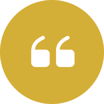 White quotation marks on gold circle