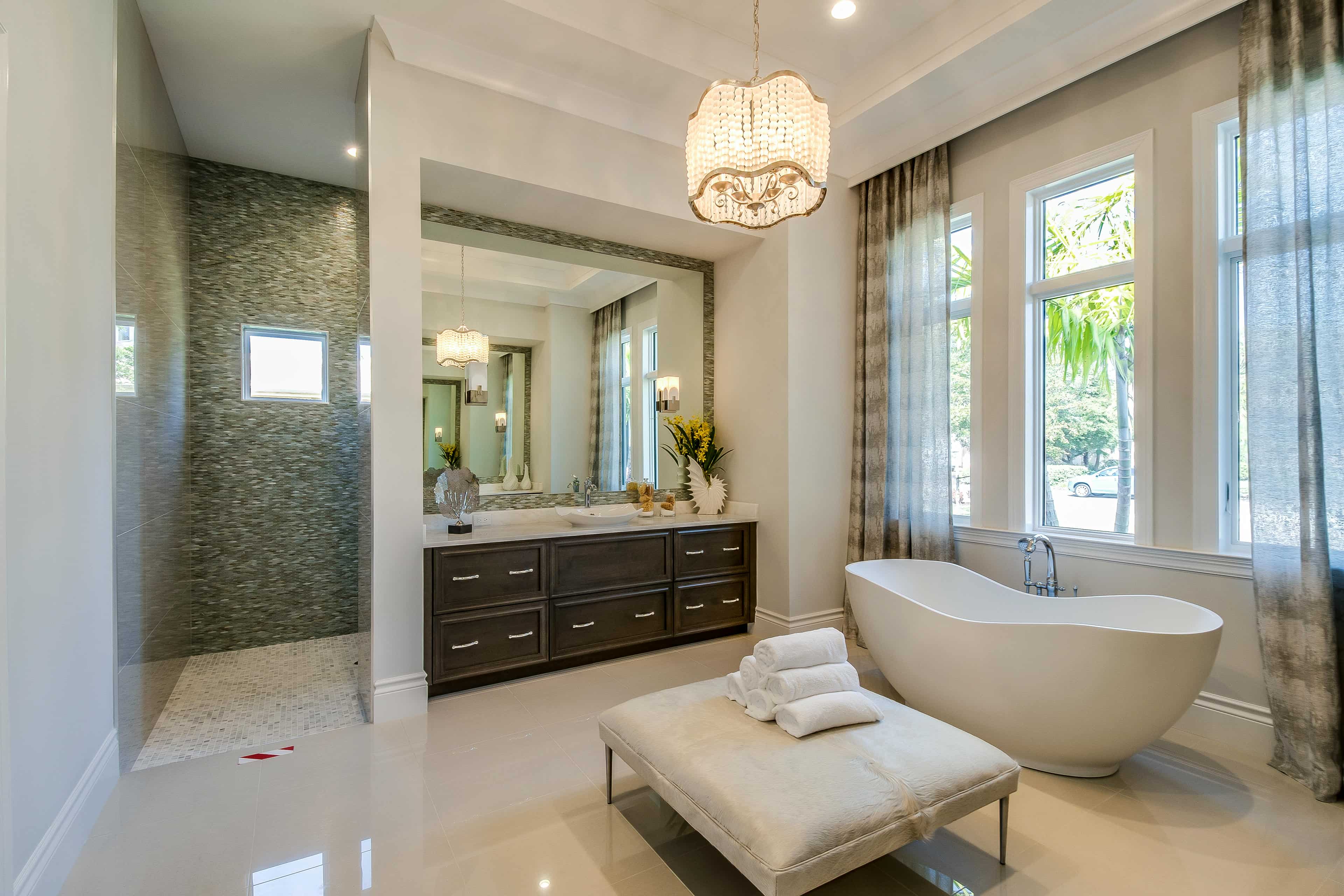 Luxurious bathroom with freestanding bathtub, vanity.