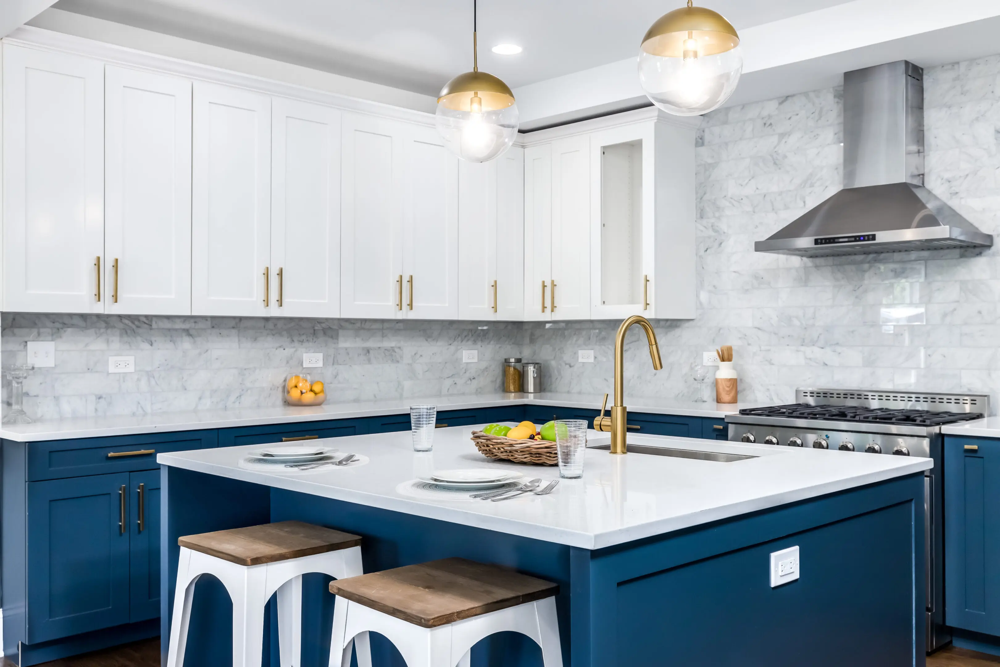 Modern kitchen with blue island and gold fixtures